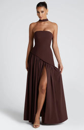 Front view of a woman in a dark brown sleeveless tube top evening gown.